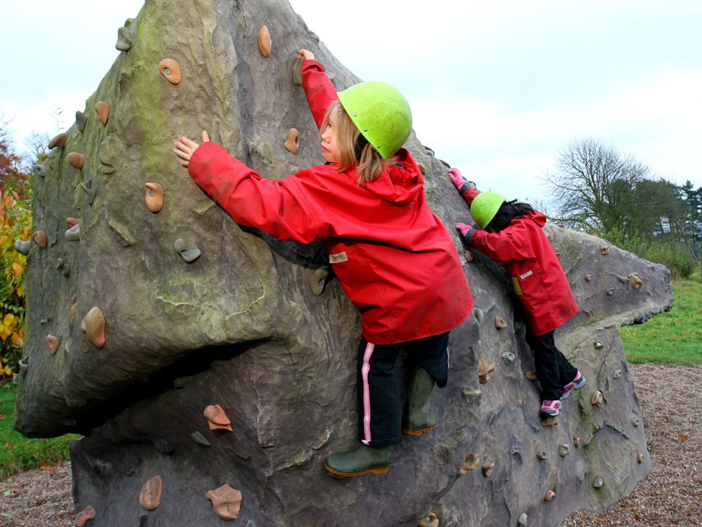 Pupils on the climbing Boulder (rock based activity)