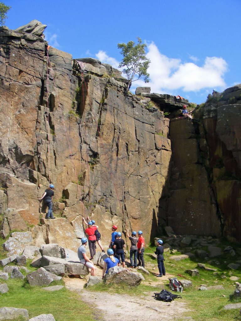 People rock climbing