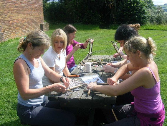 Adults making dream catchers (environmental activity) at Thornbridge Outdoors