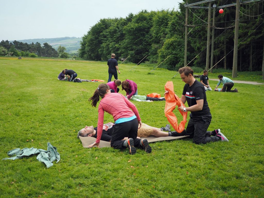 Multiple people practising first aid on a course