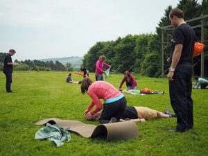 Multiple people practising first aid on a course