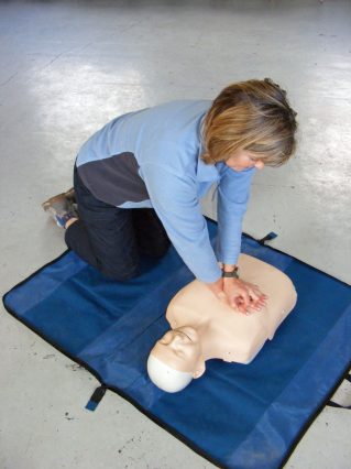 A person practising first aid on a course (onsite ground-based)