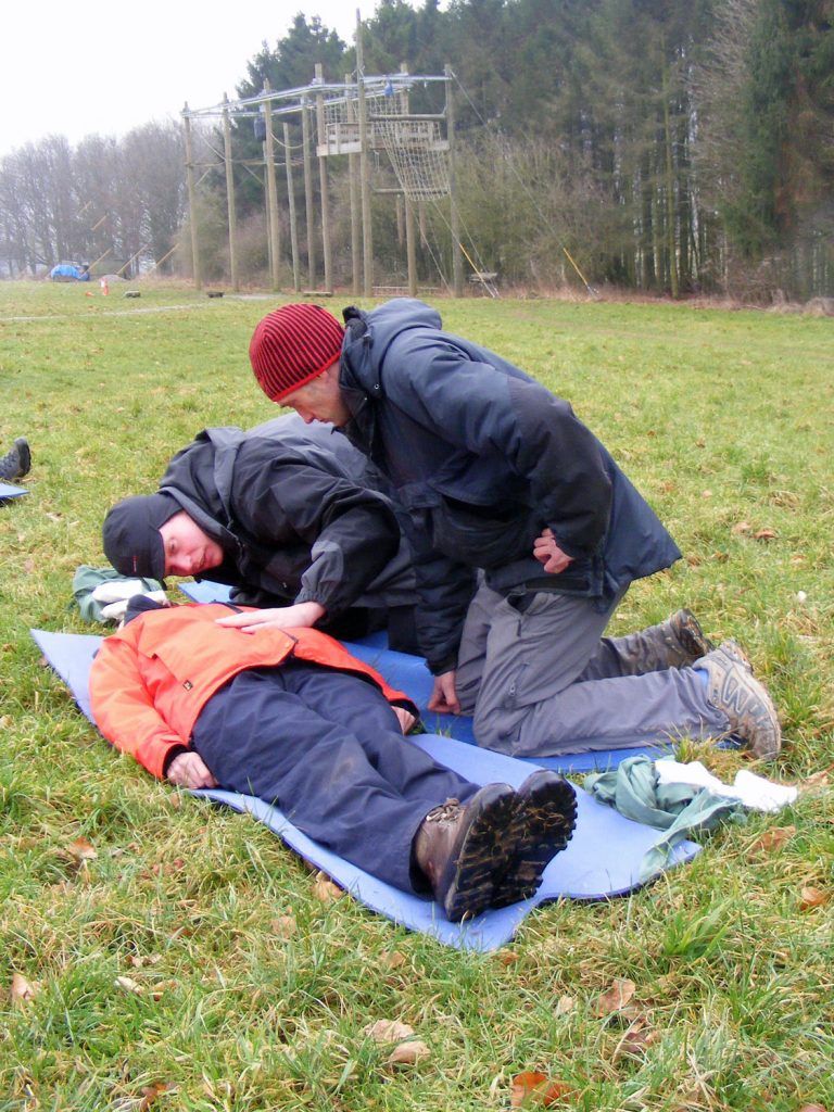 3 people practising first aid on a course