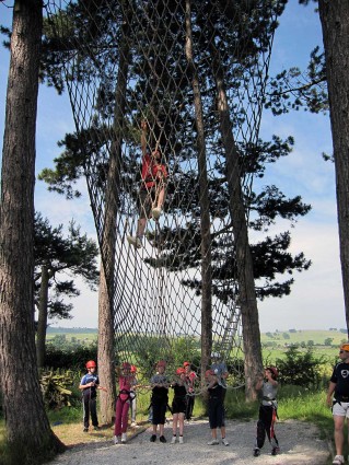 An adult and pupils on the cargo net