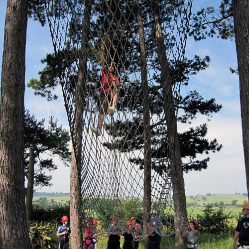 An adult and pupils on the cargo net