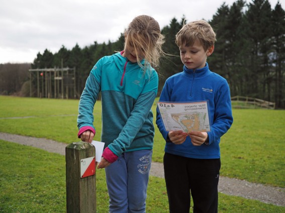 2 children orienteering (onsite ground-based) at Thornbridge Outdoors