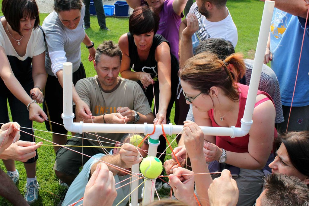 Adults participating in a problem solving activity (onsite ground-based) at Thornbridge Outdoors