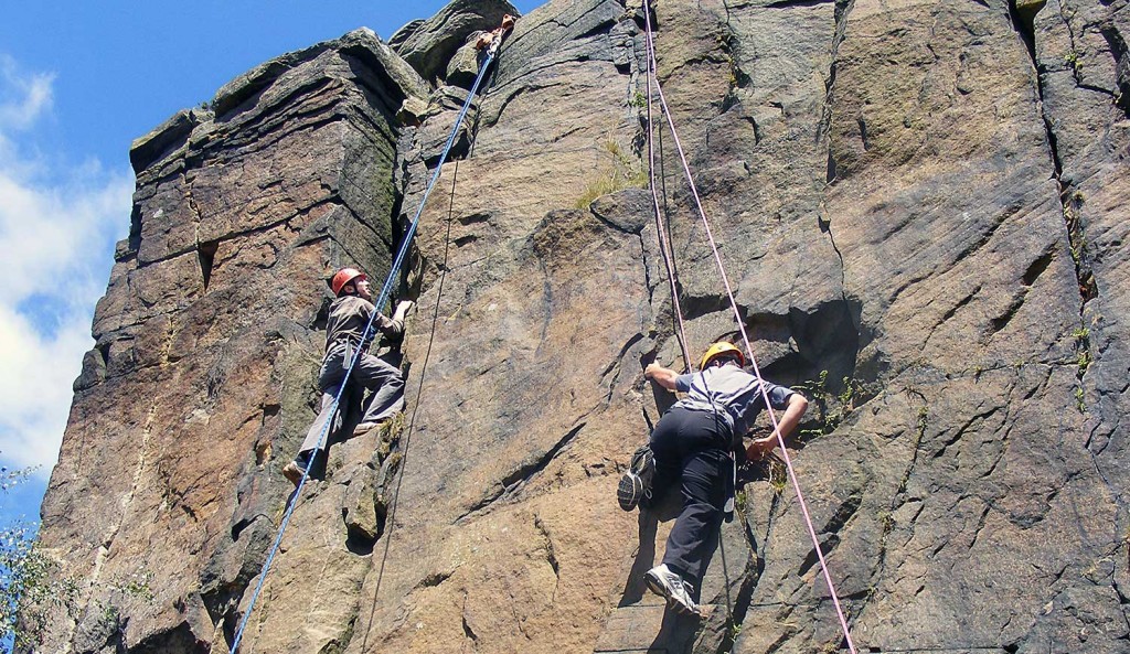 Pupils rock climbing in the Peak District