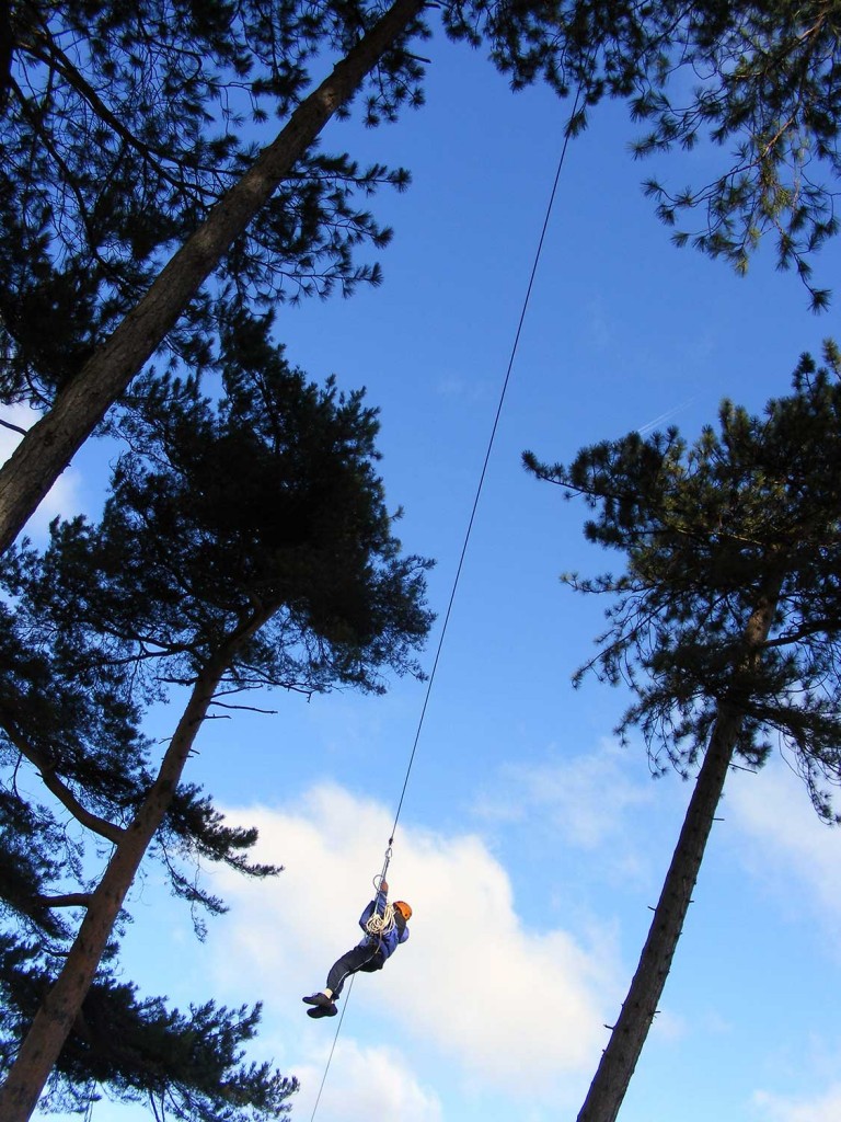 School pupil on the zip wire (high ropes) at Thornbridge Outdoors