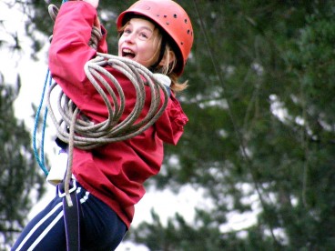 School pupil on the zip wire (high ropes) at Thornbridge Outdoors