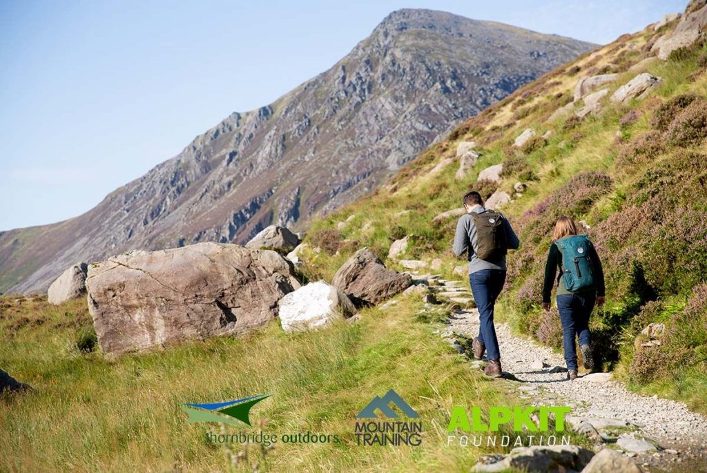 Adults walking up a hill